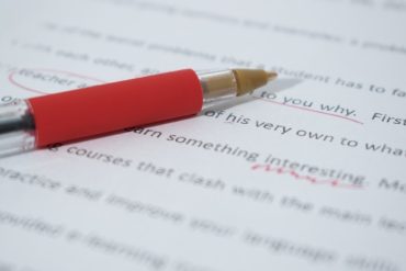 Proofreading, Editing, Spellchecking-Red Pen on top of corrected text
