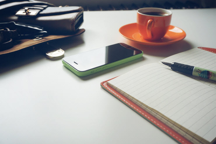 Build Your Email List desk with phone cup of coffee and notebook